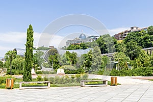 Scenic beautiful view panorama of old historic city Tbilisi center, large tubes of Rike park, architecture building, Georgia in