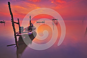 A scenic beauty of traditional fishing boat with sunset at Teluk Sengat,Johore