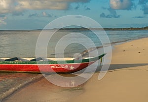 Scenic boat on a sandy beach, Madagascar holiday