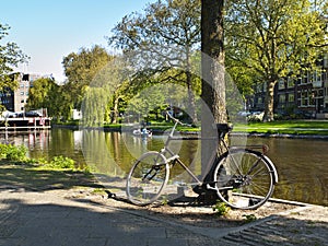 Scenic Bycicle in an Amsterdam Canal photo