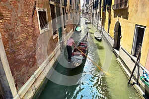 Scenic canal with gondola, gondolier, Venice, Italy