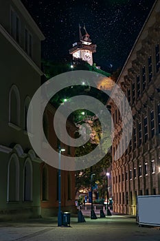 Scenic cityscape of Schlossberg and Grazer Uhrturm - clock tower, Graz, Austria at starry night photo