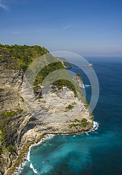 Scenic coast landscape view of Asian paradise island with beautiful turquoise sea water color surrounded by rock cliffs and green