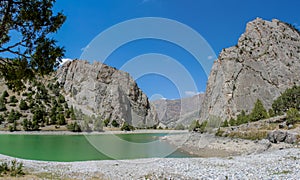 Scenic crystal lake panorama in Fan mountains in Pamir, Tajikistan