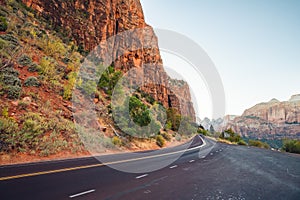 Scenic curved red rock asphalt road in Zion National Park
