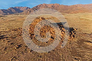 Desert landscape with rocks and arid grassland, Brandberg mountain, Namibia photo