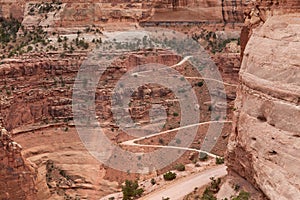 Scenic Dirt Road surrounded by Red Rock Mountains in Desert Canyon.