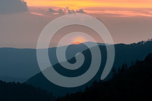 Scenic drive from Cowee Mountain Overlook on Blue Ridge Parkway at sunset time.