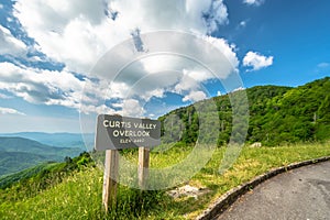Scenic drive from Curtis Valley Overlook elevation 4460 ft. on Blue Ridge Parkway, Blue sky background with cloudy