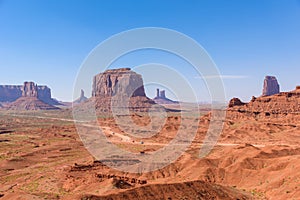 Scenic Drive on Dirt Road through Monument Valley, The famous Buttes of Navajo tribal Park, Utah - Arizona, USA. Scenic road and