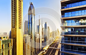 Scenic elevated view over famous road in Dubai with skyscrapers.