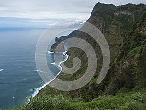 Scenic elevated view towards the Rocha do Navio Reserve and Ponta de Catarina Pires cape. Ocean, tropical green photo