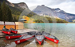 Scenic Emerald lake shore with Canoes fore end in British Columbia, Canada