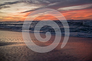 Scenic empty sandy beach against the seascape at sunset in Hawaii