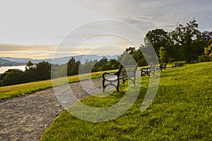 Scenic evening view of Balloch Castle Country Park with historic benches and Loch Lomond in Scotland, United Kingdom.