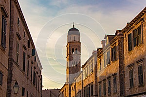 Scenic evening view at the bell tower of the Franciscan church and monastery on famous historic Stradun street