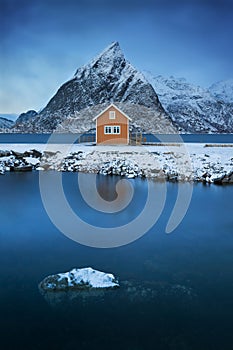 Scenic fjord on Lofoten islands, Reine, Norway. Cabin in village. Famous tourist attraction on Lofoten Islands.