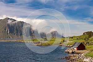 Scenic fjord on Lofoten islands with typical fishing hut