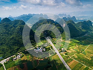 Scenic highway in Guangxi province of China surrounded with rice fields and rocks