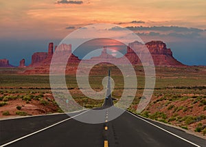 Scenic highway in Monument Valley Tribal Park in Arizona-Utah border, U.S.A. at sunset.