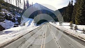 Scenic Highway surrounded by Mountains, Trees and Snow. Daytime, Duffy Lake Road. Near Pemberton