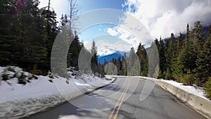 Scenic Highway surrounded by Mountains, Trees and Snow. Daytime, Duffy Lake Road. Near Pemberton