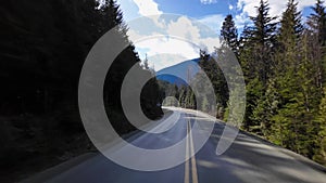 Scenic Highway surrounded by Mountains, Trees and Snow. Daytime, Duffy Lake Road. Near Pemberton