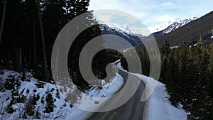 Scenic Highway surrounded by Mountains, Trees and Snow. Sunrise, Duffy Lake Road. Near Pemberton