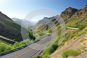 scenic highway with twisty curves and scenic view of the mountains