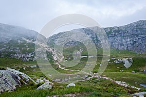 Scenic hiking path to famous Kjerag stone. Norway.