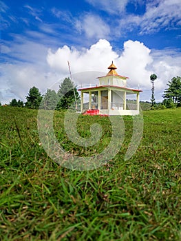 Scenic Hindu temple amidst Himalayan meadow in Uttarakhand, India