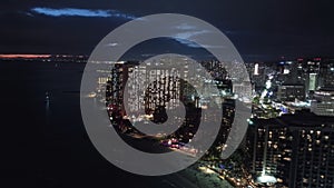 Scenic illuminated Honolulu skyline at sunset, Aerial Oahu city at night scene