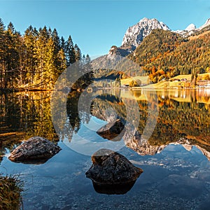 Scenic image at the Mountain lake Hintersee in the Bavarian Alps during a vibrant sunny Sunrise. Hintersee lake, Bavaria