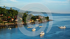 Scenic lagoon with boats in small village Amed