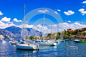 Scenic lake Lago di Garda, view with sailing boats, Northen Ital