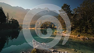 Scenic Lake and mountains lit with warm morning light