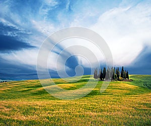 Scenic landscape with hills against clouds in Val d `Orcia, Tuscany, Italy. Wonderful places