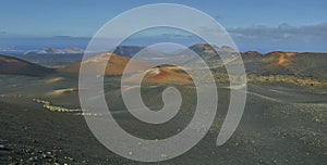 Scenic landscape oVolcanic landscape at Timanfaya National Park on Lanzarote Islandn the island of lanzarote in the atlantic ocean photo