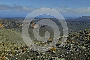 Scenic landscape oVolcanic landscape at Timanfaya National Park on Lanzarote Islandn the island of lanzarote in the atlantic ocean photo