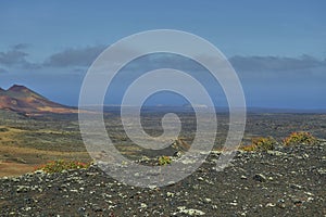 Scenic landscape oVolcanic landscape at Timanfaya National Park on Lanzarote Islandn the island of lanzarote in the atlantic ocean photo