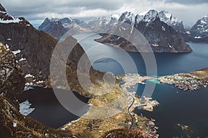 Scenic landscape of Lofoten islands: peaks, lakes, and houses. Reine village, rorbu, reinbringen