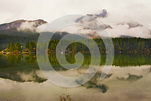Scenic Landscape of low clouds of autumn and Piz da La Margna and Lake of Segl Silsersee Swiss