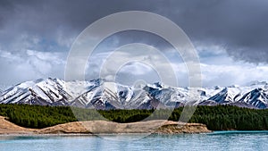 A scenic landscape of New Zealand Southern Alps and Lake Pukaki