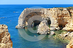 Scenic landscape of Praia da Marinha Arco Natural double arch cliffs in Algarve photo