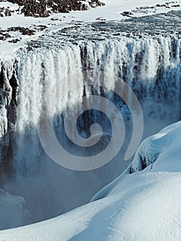 Scenic landscape shot of a majestic frozen waterfall in winter