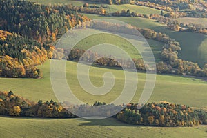 Scenic landscape in Sulov, Slovakia, on beautiful autumn sunrise with colorful leaves on trees in forest and bizarre pointy rocks