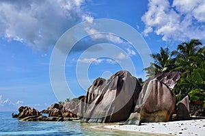 Scenic landscape of sunny tropical Anse Source D`Argent Beach on La Digue Island, Seychelles