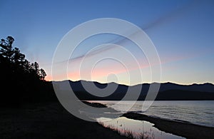 A scenic landscape - summer sunset in a Zmeyevaya Bay (Snake Bay), peninsula Svyatoy Nos, Baikal Lake photo