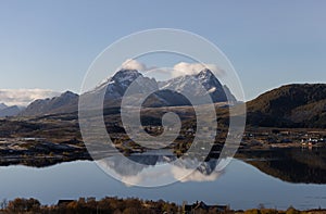 Scenic landscape with two mountains reflecting in lake in Lofoten, Norway