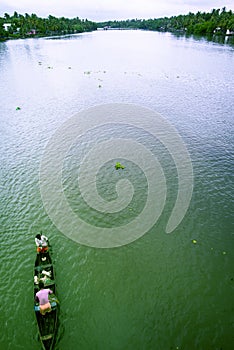 Landscape view of mezzo fishing in middle of river photo